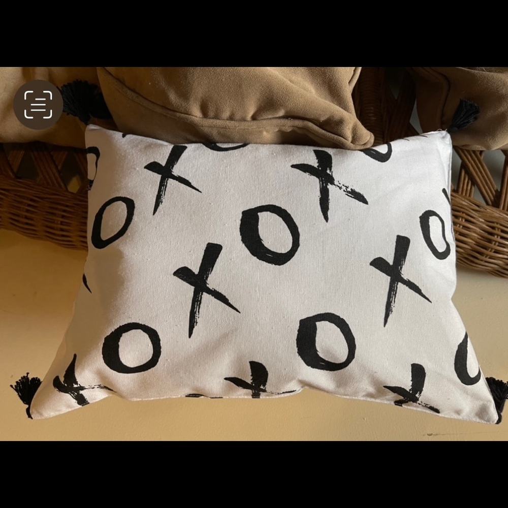 XO love pillow with fringes.
